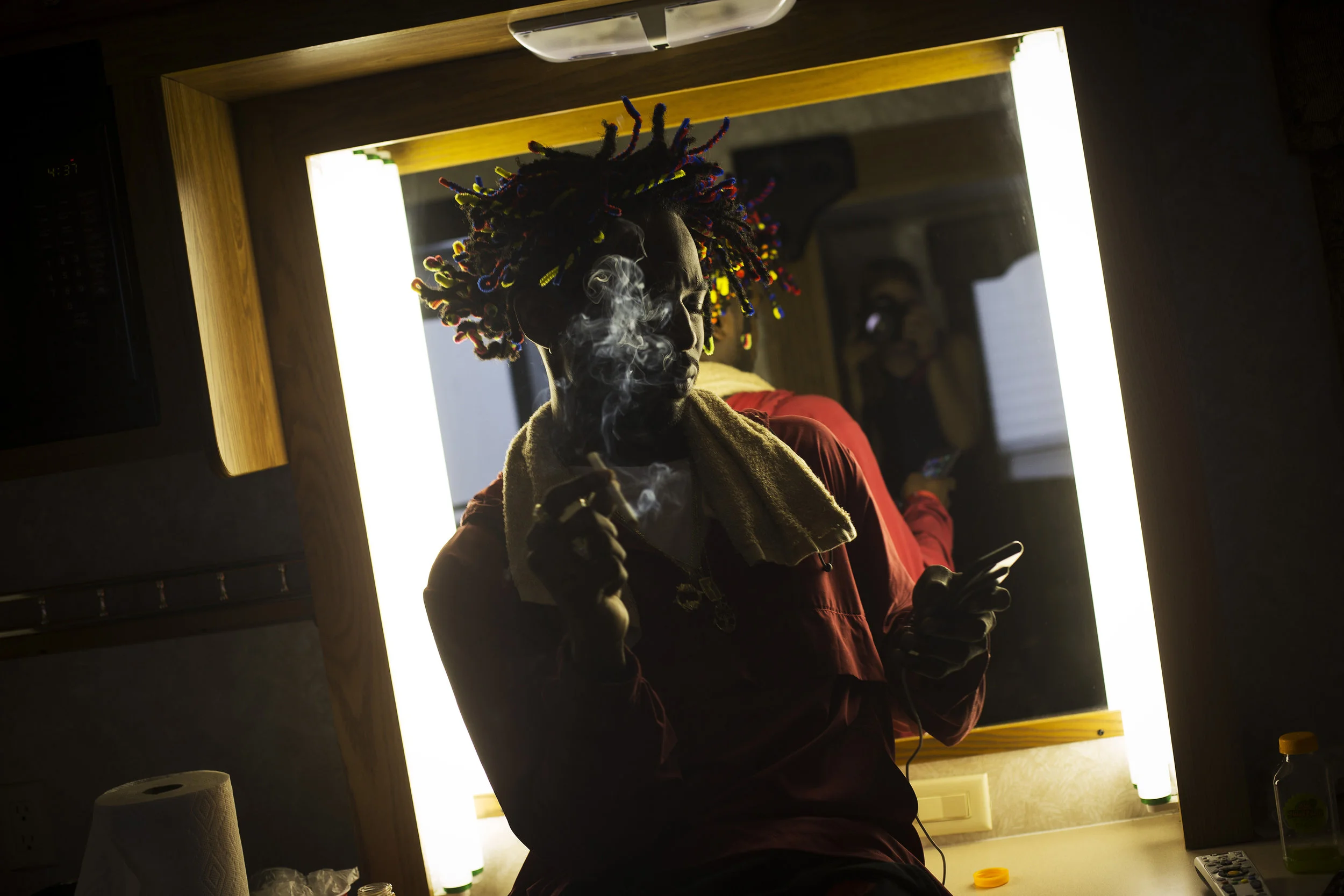 Jazz Cartier smokes a cigarette inside his trailer after performing at JMBLYA, in between media interviews. “A lot of people think that cuz I went to boarding school and shit like that, that I had a silver spoon my whole fucking life,” he said. “My mom had me when she was like 19 and my dad wasn’t really in the picture. So, it was mostly her fending for us, like days where we had to split happy meals and she would eat whatever I left for her, because that’s how we had it.”