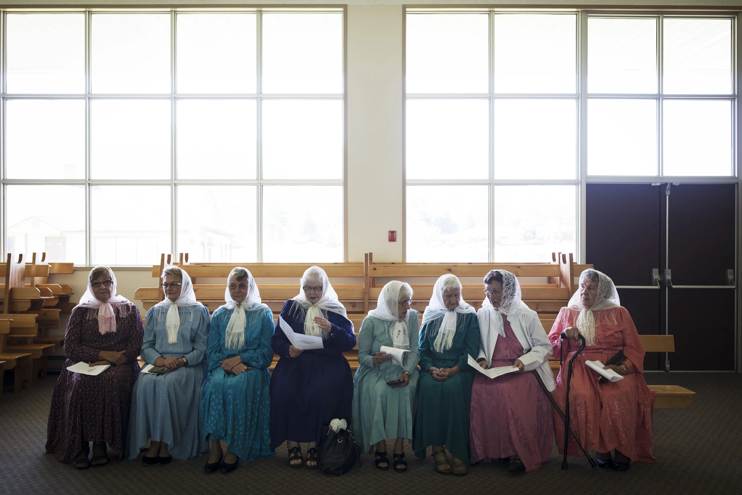 Women wearing the traditional plotochik, or shawl, assemble for a payer meeting at the Union of Spiritual Communities of Christ community centre in Grand Forks, British Columbia, on Declaration Day.