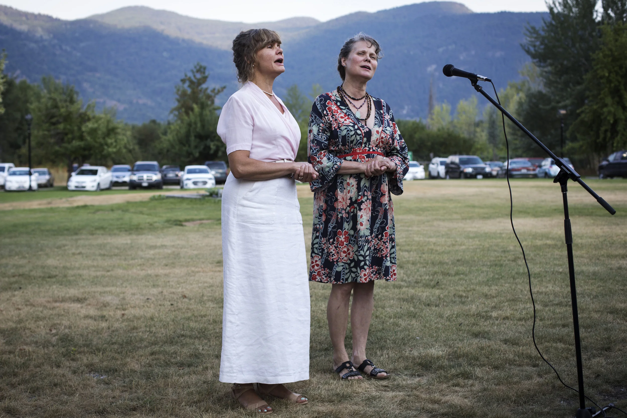 Sisters, Tony Fominoff (left) and Netta Zeberoff, sing during a gathering to commemorate Hiroshima Day outside the MIR Centre for Peace in Castlegar, British Columbia.