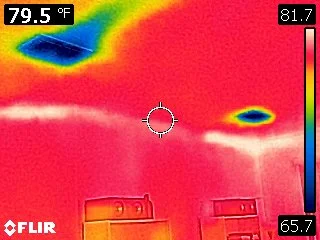 Thermal Imaging - The two blue sections at the top of the picture is the homes ceiling Air Conditioner Vents.. The Thermal image shows how one vent is blowing more cold air across the ceiling than the other