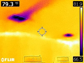 Thermal Imaging - Different color pattern. The two purple sections at the top of the picture is the homes ceiling Air Conditioner Vents.. The Thermal image shows how one vent is blowing more cold air across the ceiling than the other