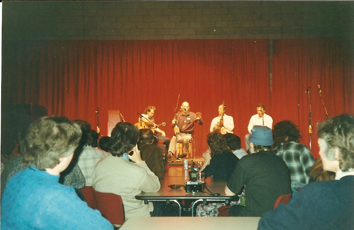 The New Hampshire Fiddlers Union: Gordon (guitar) Randy Miller, Rodney Miller, Skip Gorman, playing for a very educated audience.