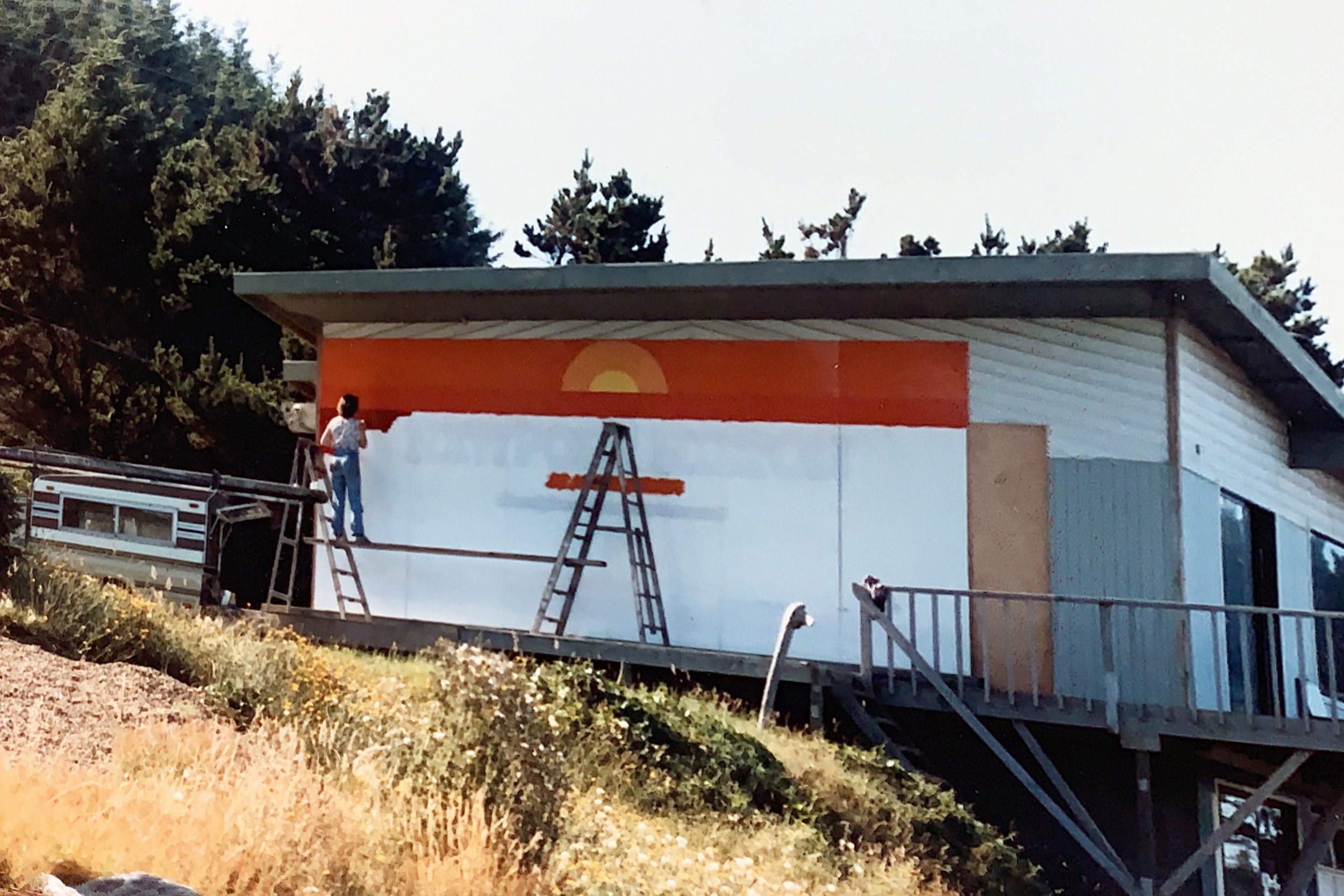 Marti Painting a Sign on the Oregon coast 