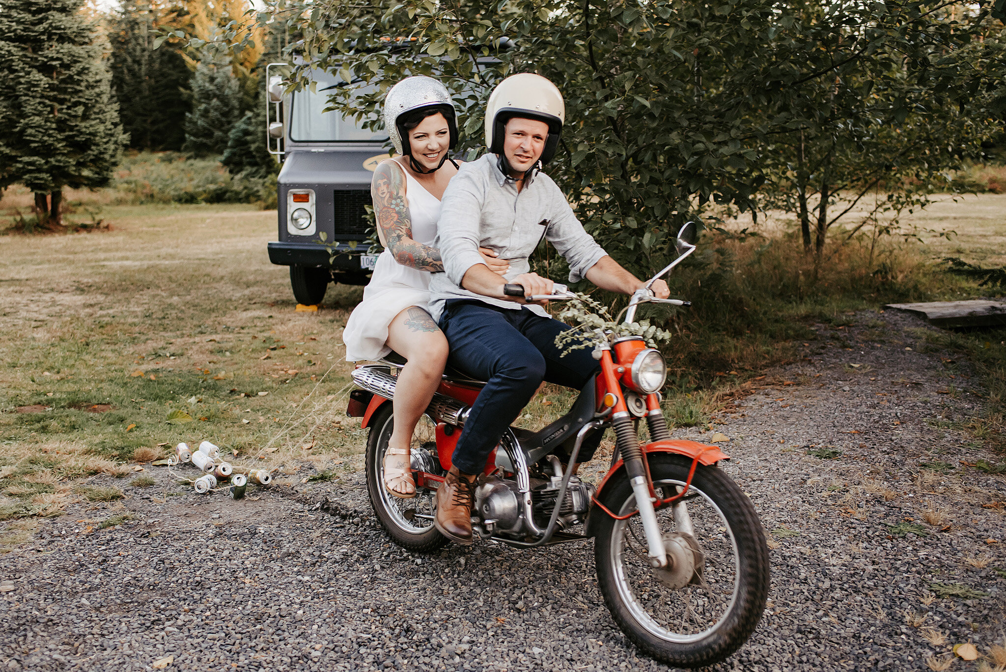 Bride and groom ride on motorcycle during their wedding reception