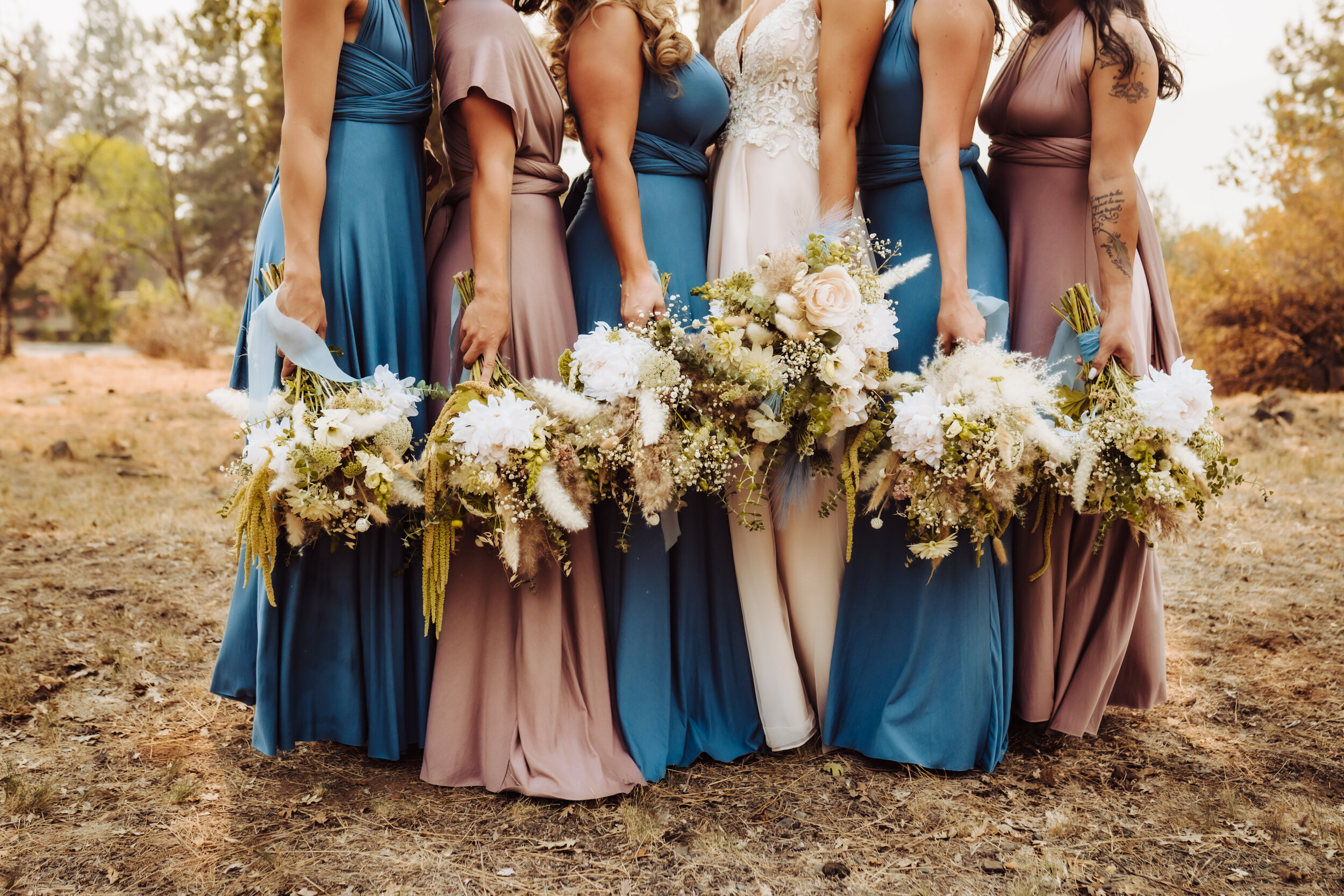 Detail photograph of bride and bridesmaids holding their bouquets