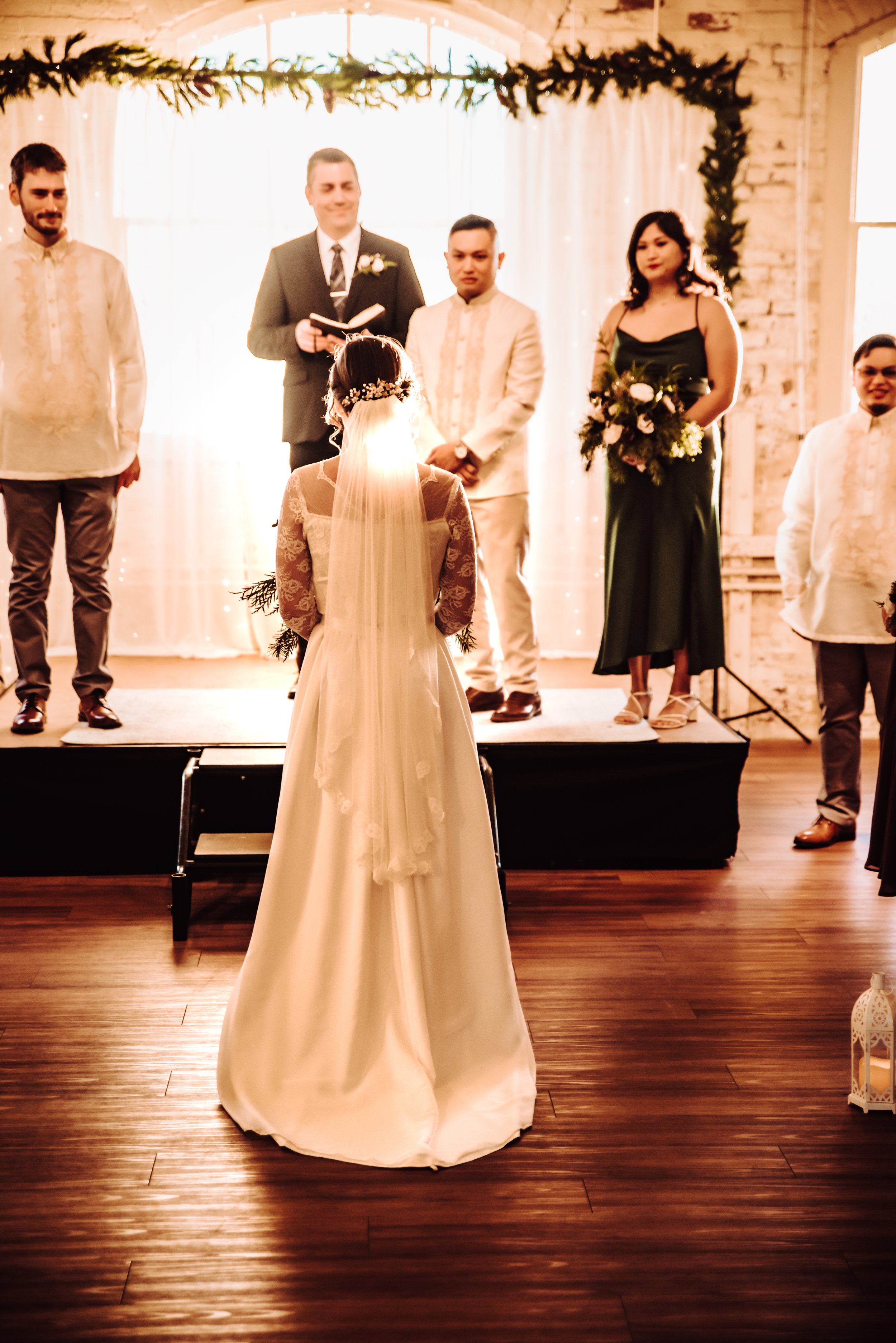 Bride walking down the aisle toward her future husband