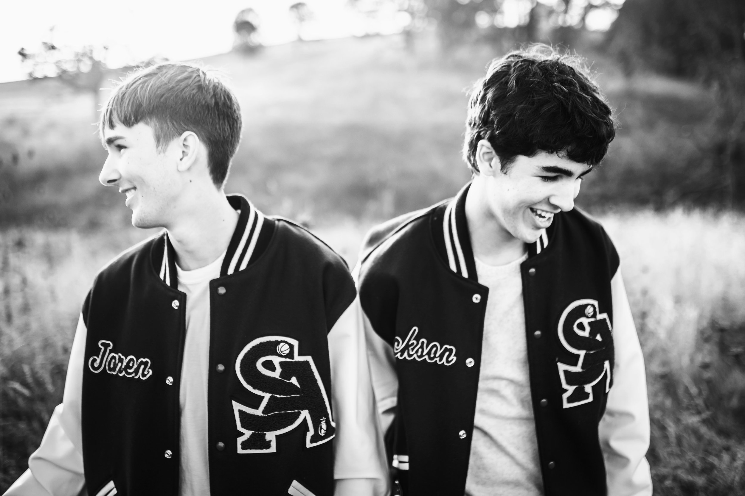 Black and white of 2 senior boys laughing