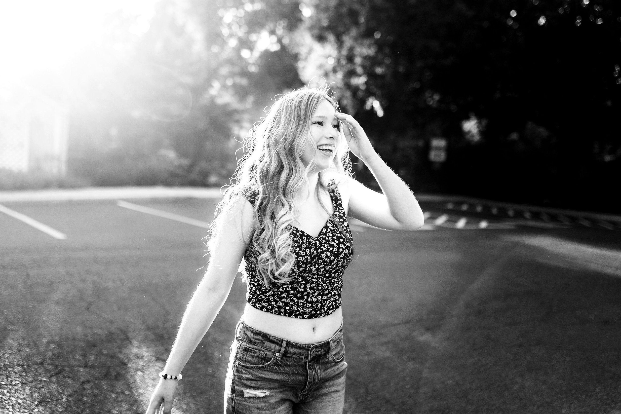 Senior girl laughing in black and white