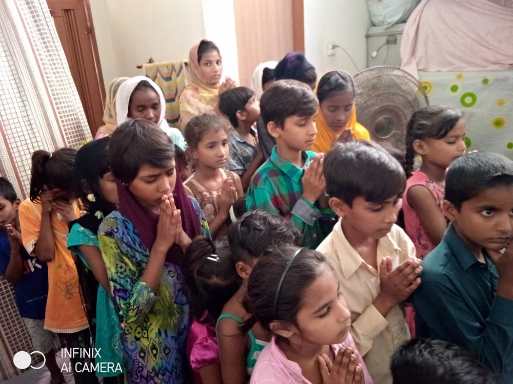 Students and families taking part in the St. John Eudes Home Schooling System in Karachi.