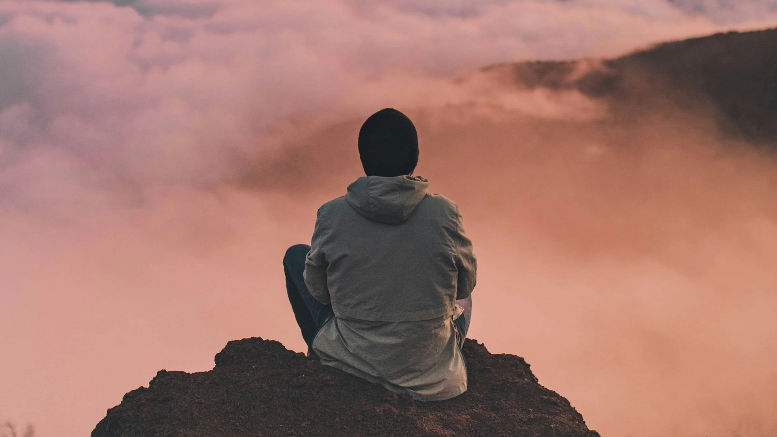 image of a mad sitting alone representing over dependence is a trauma response