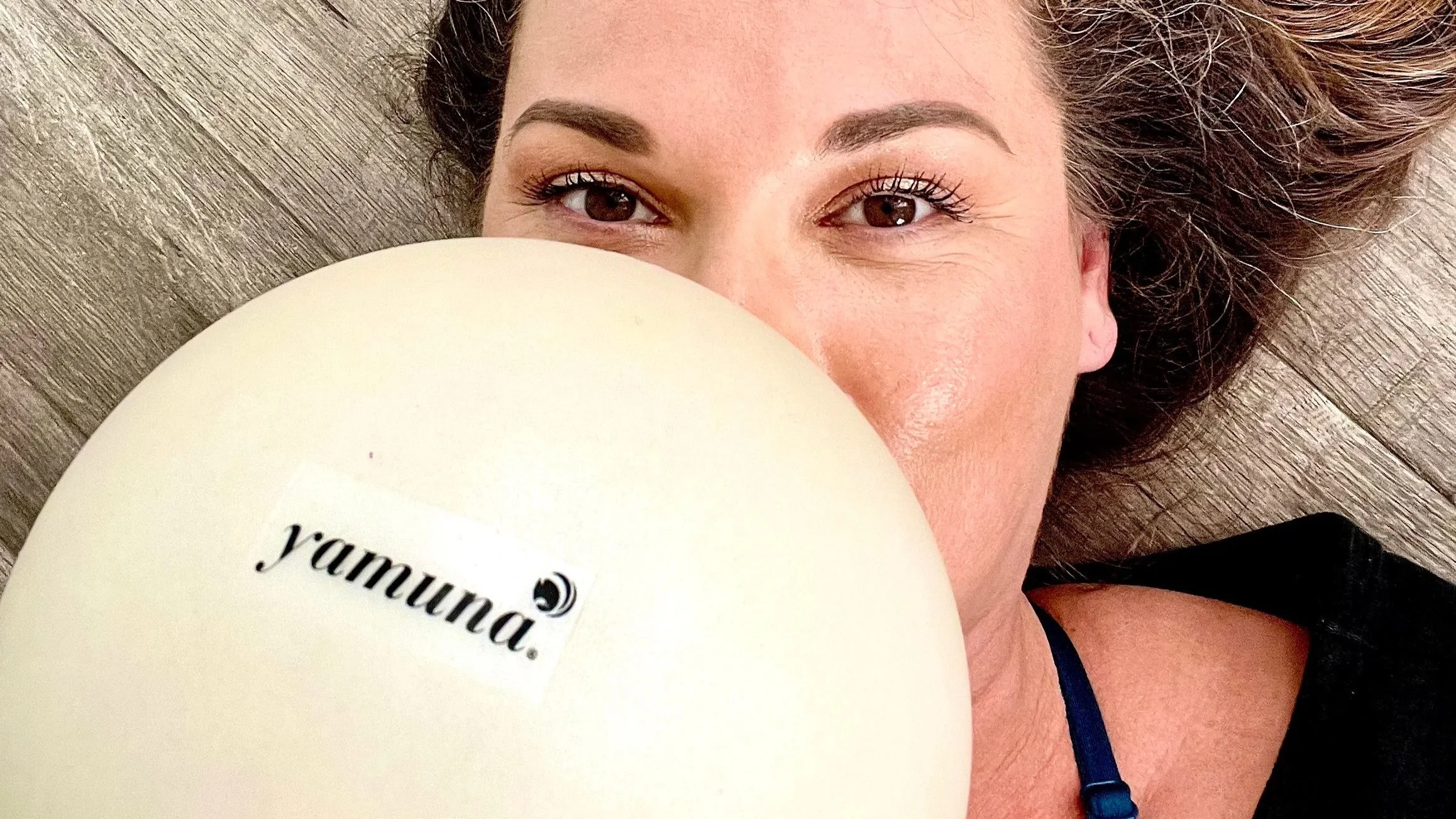 woman holding yamuna body rolling balls