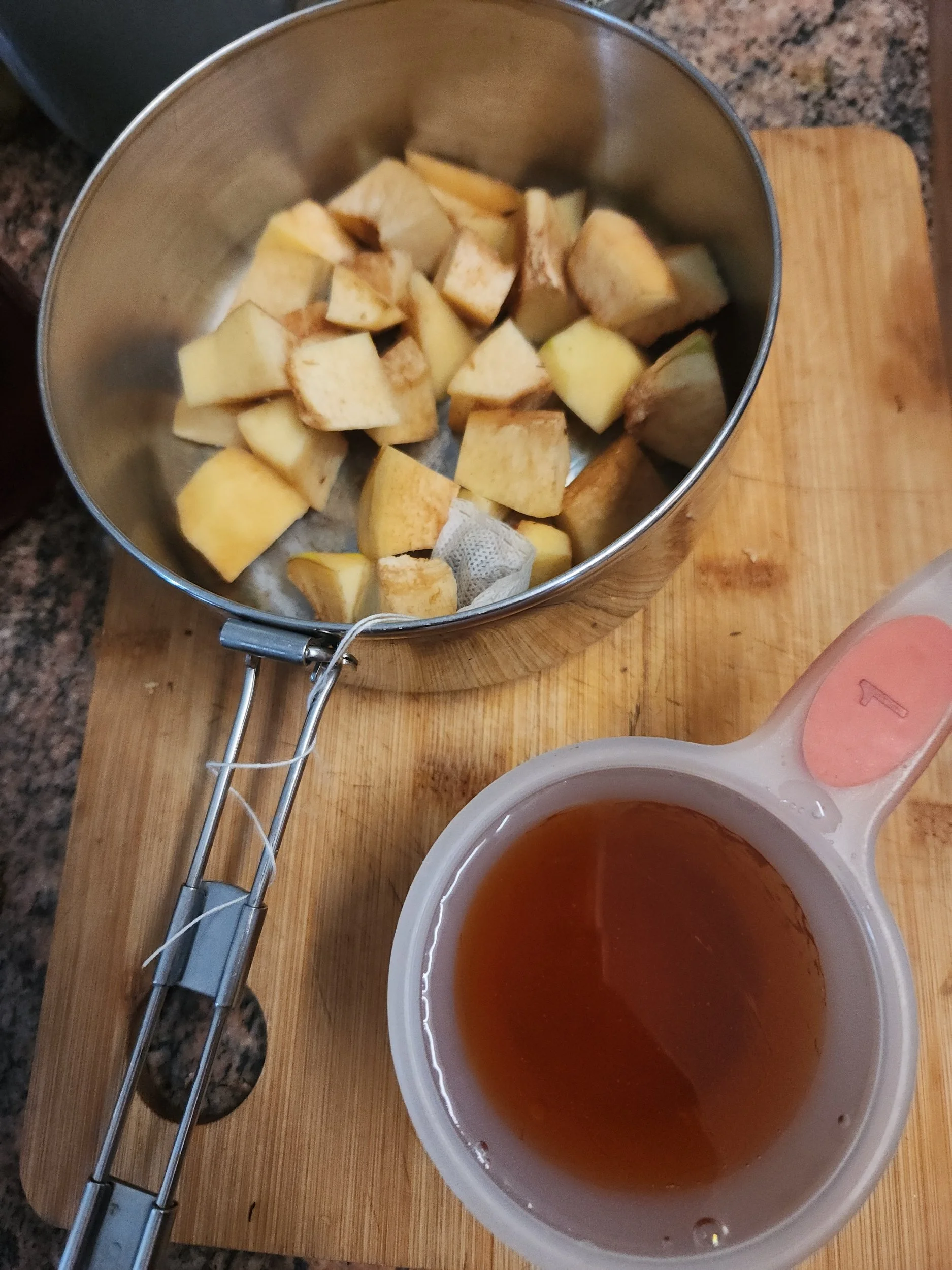 Chopped quince in pot with honey