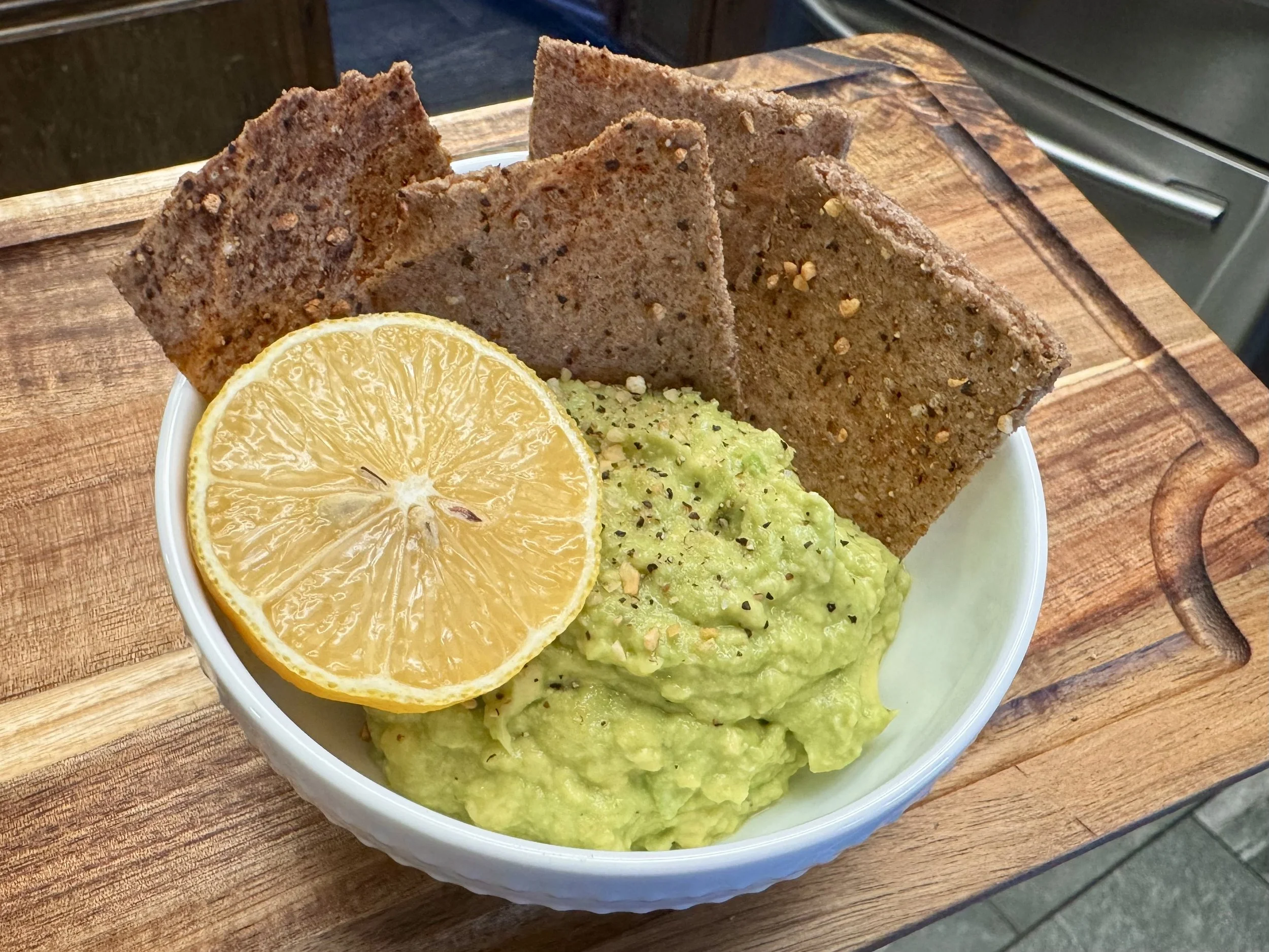 Rye sourdough crackers with guacamole and lemon