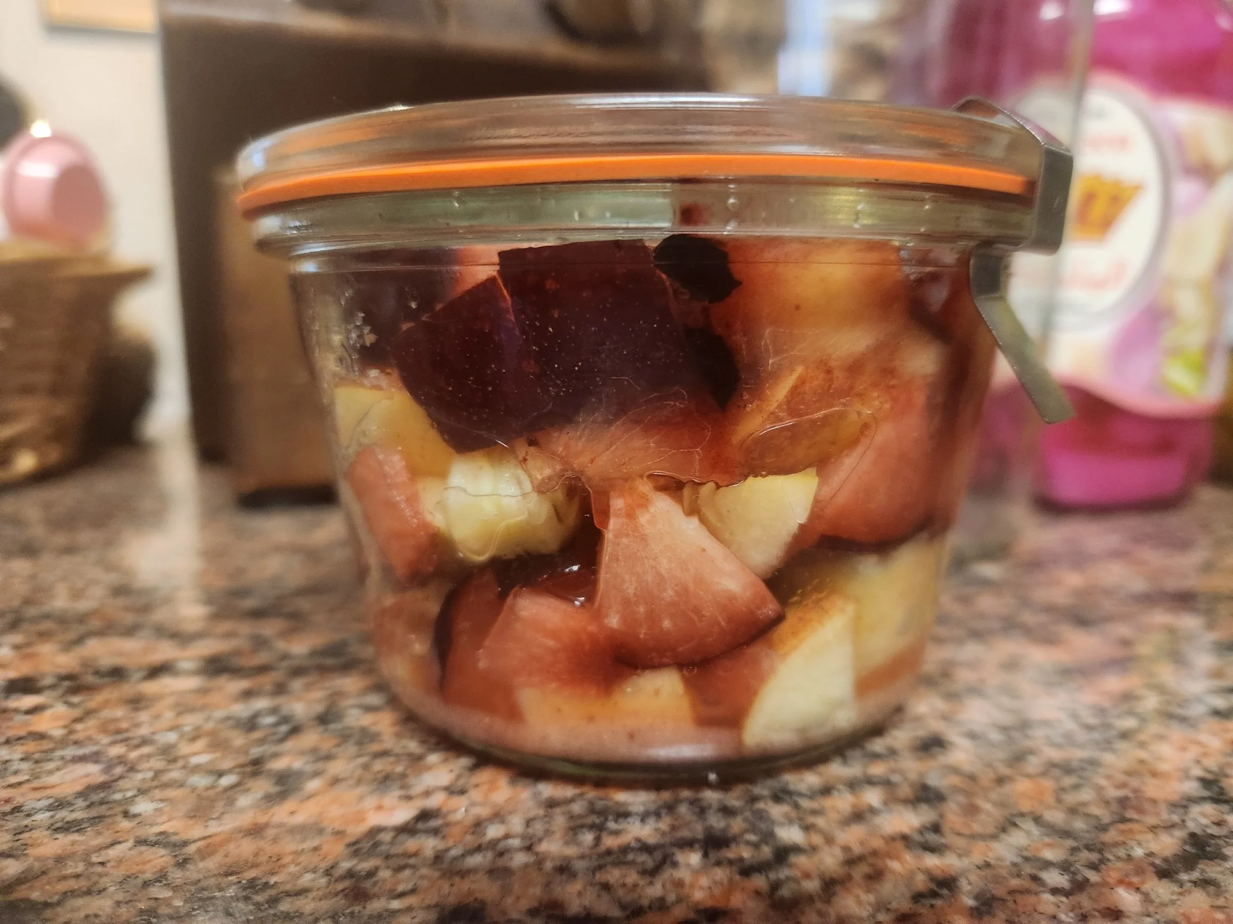 Jar of fermented plums