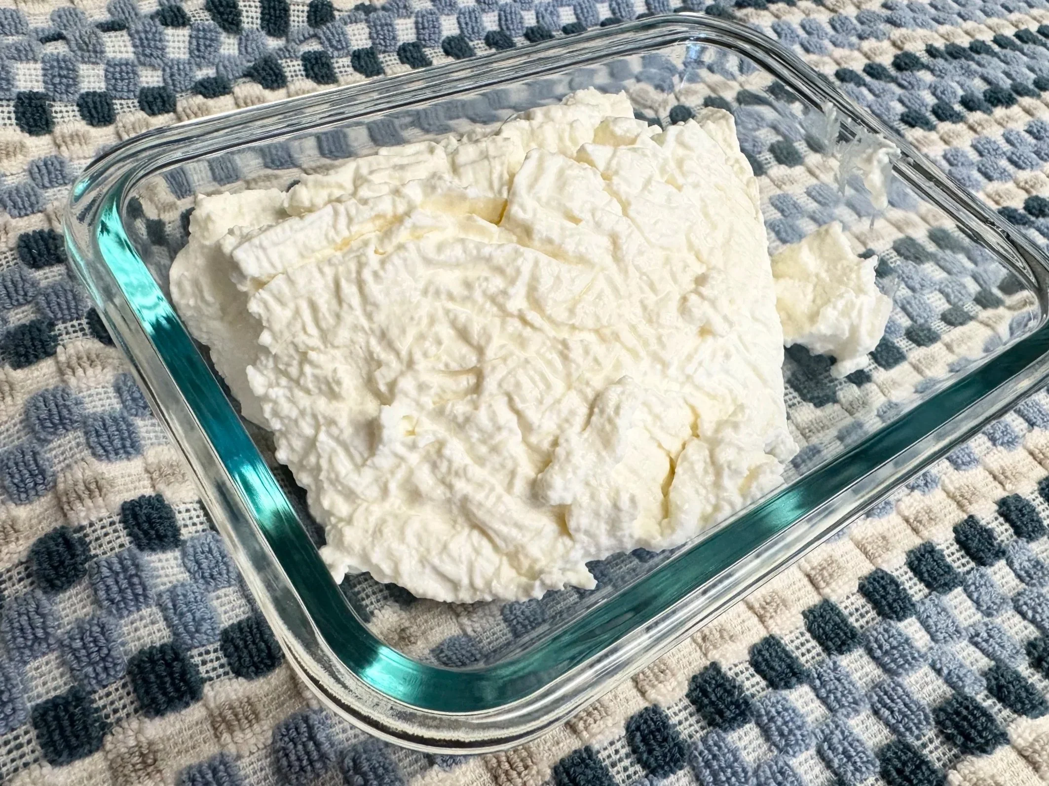 Strained milk kefir in glass bowl
