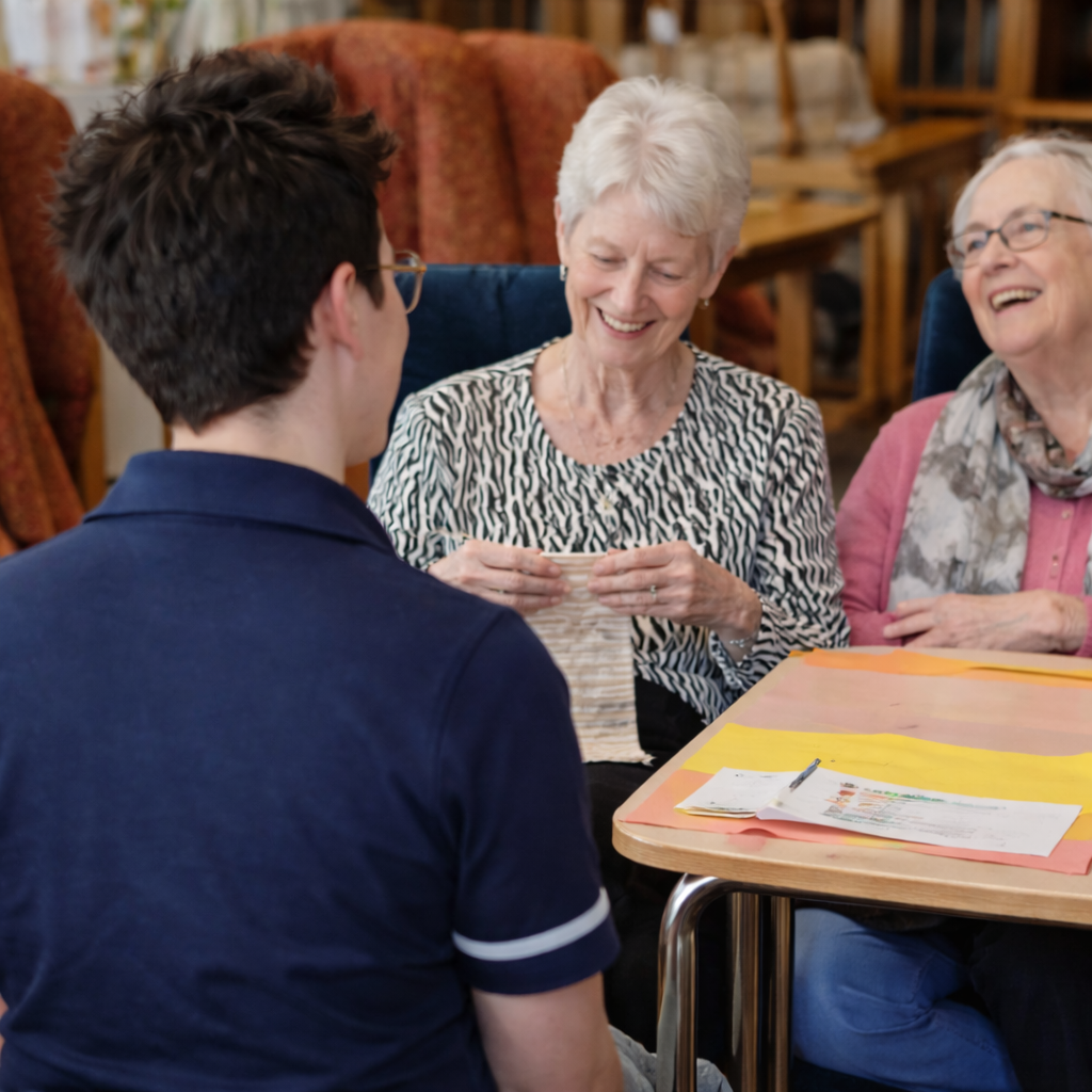 Care home podiatry services in Bangor Northern Ireland with elderly residents receiving support and foot care in a friendly group setting.