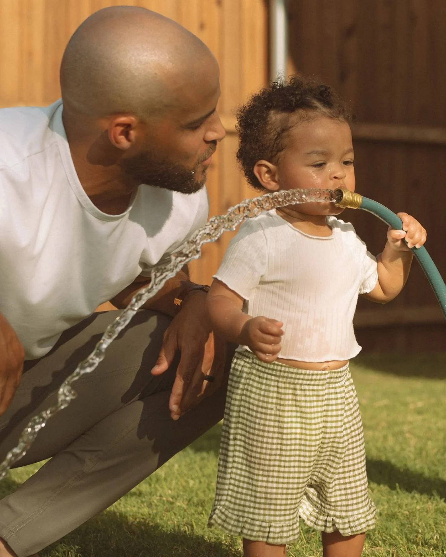 Summertime happy &mdash; at home &mdash; playing in the water with mom and dad. dad teaching you how to take a sip from the water hose. laughter filling the air. simple moments, full of joy and love. moments that last a lifetime&hellip;summertime hap