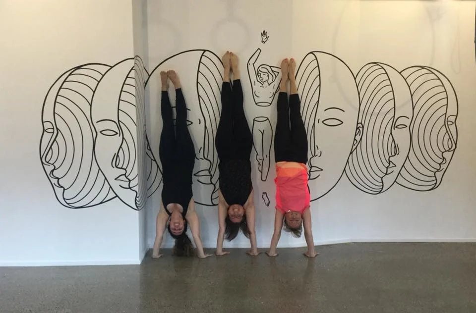 Friday night handstand class - I am on the right in orange