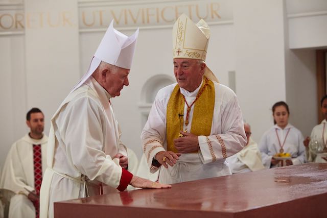Archbishop Vincent Nichols and Bishop Michael Campbell bless the altar