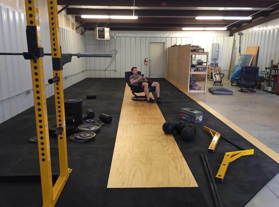 Kyle taking a break from assembling equipment in Strength Ratio’s brand new gym space in 2017