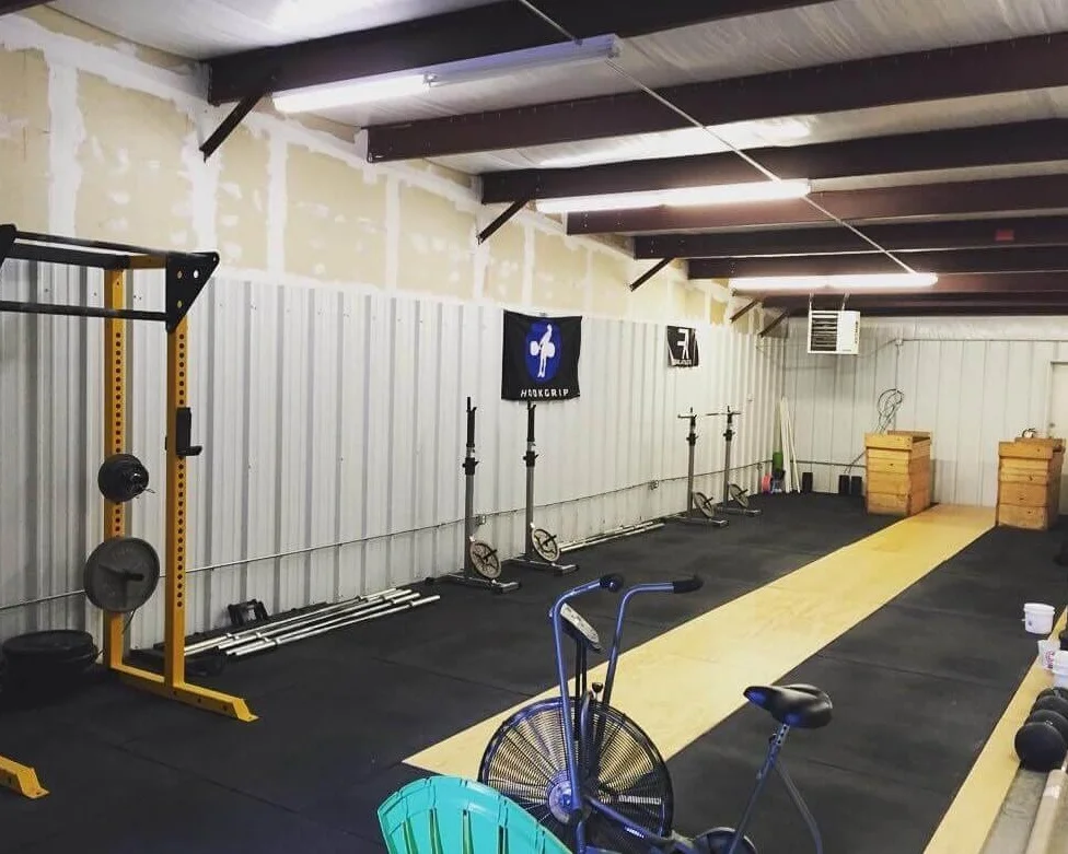 Strength Ratio’s first gym space in 2017: half a warehouse, 3 squat racks, 1 air dyne, and a lot of potential