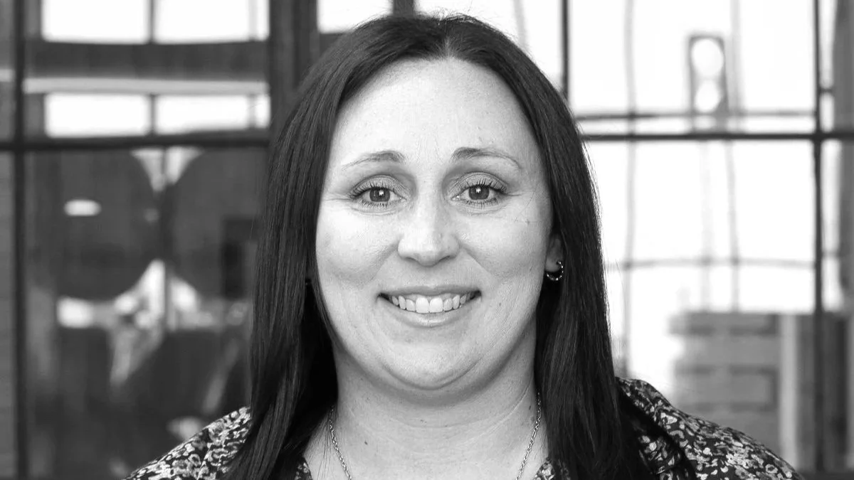 A black and white photo of Ashley Bechtold