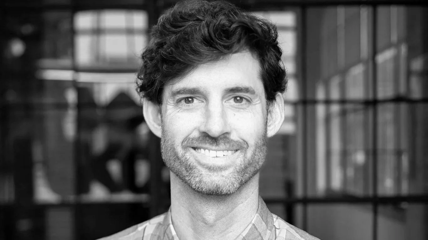 A black and white image of Scott Brelsford, Architect
