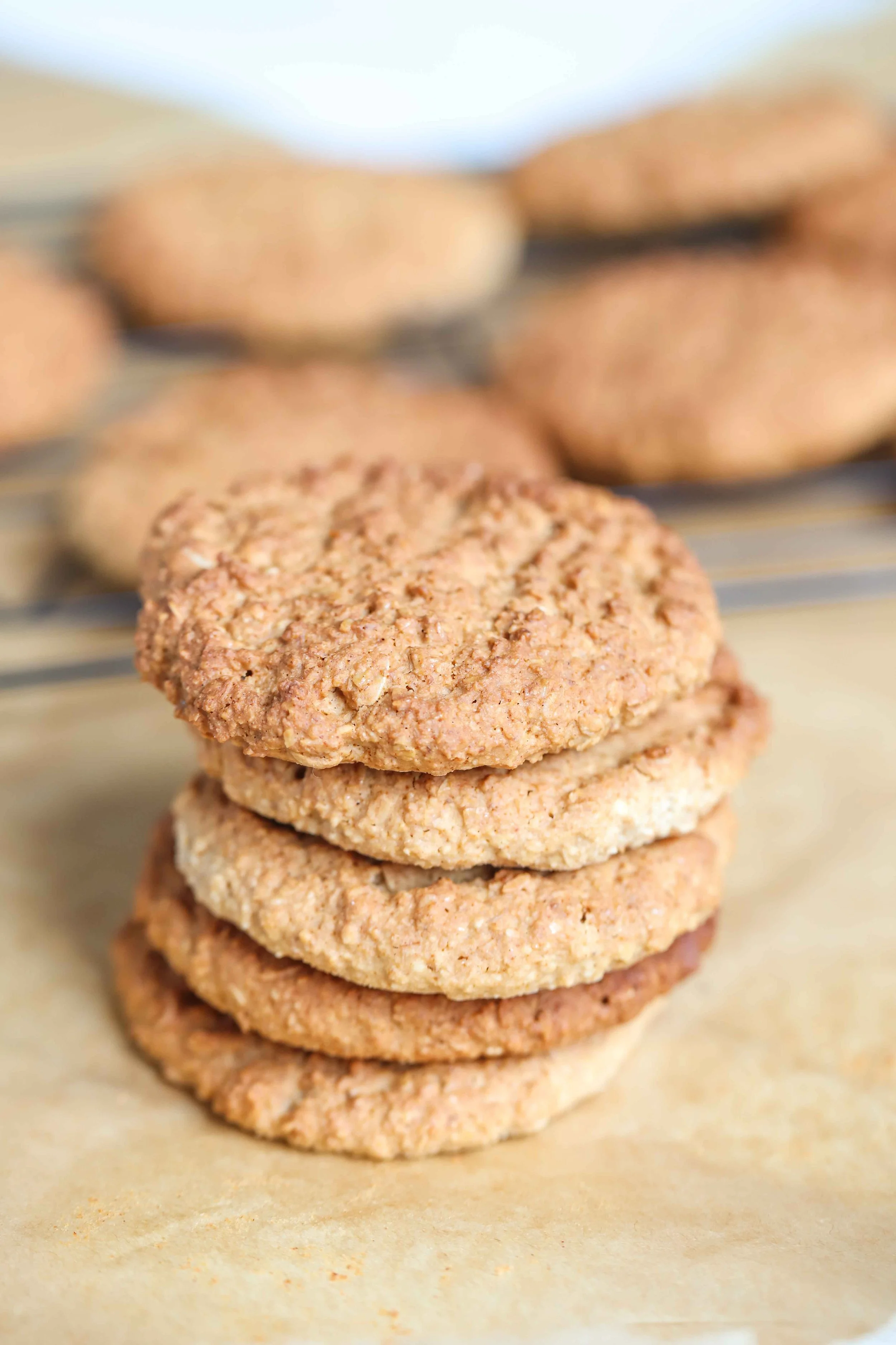 Oatmeal Almond Cookies in a stack on parchment paper