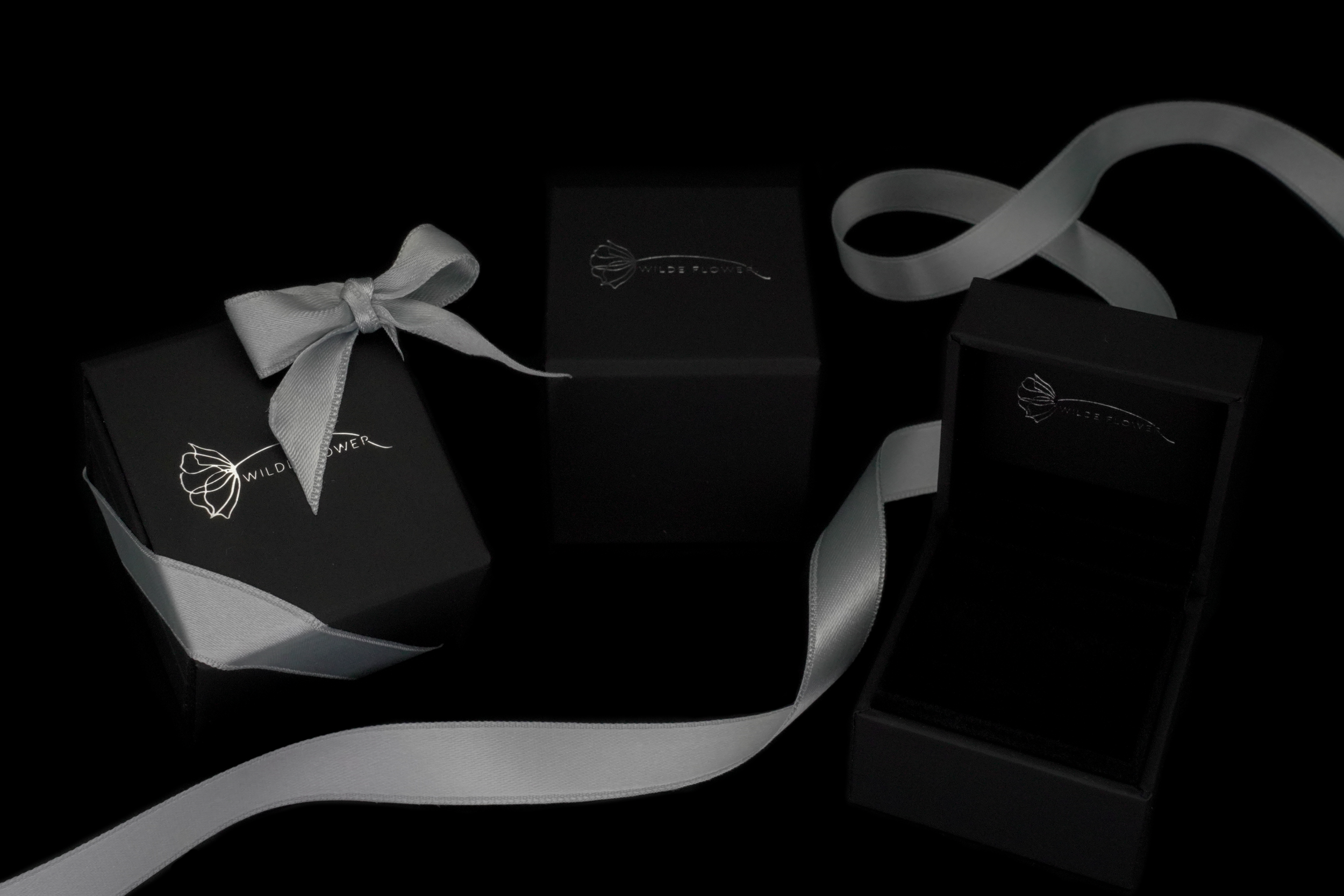 Luxury Wilde Flower jewellery packaging for the Gold Twisted Ivy Ring, featuring a velvet-lined presentation box with silver ribbon.