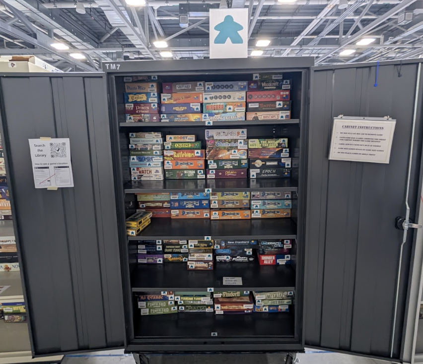 Cabinet of Games with teal meeple
