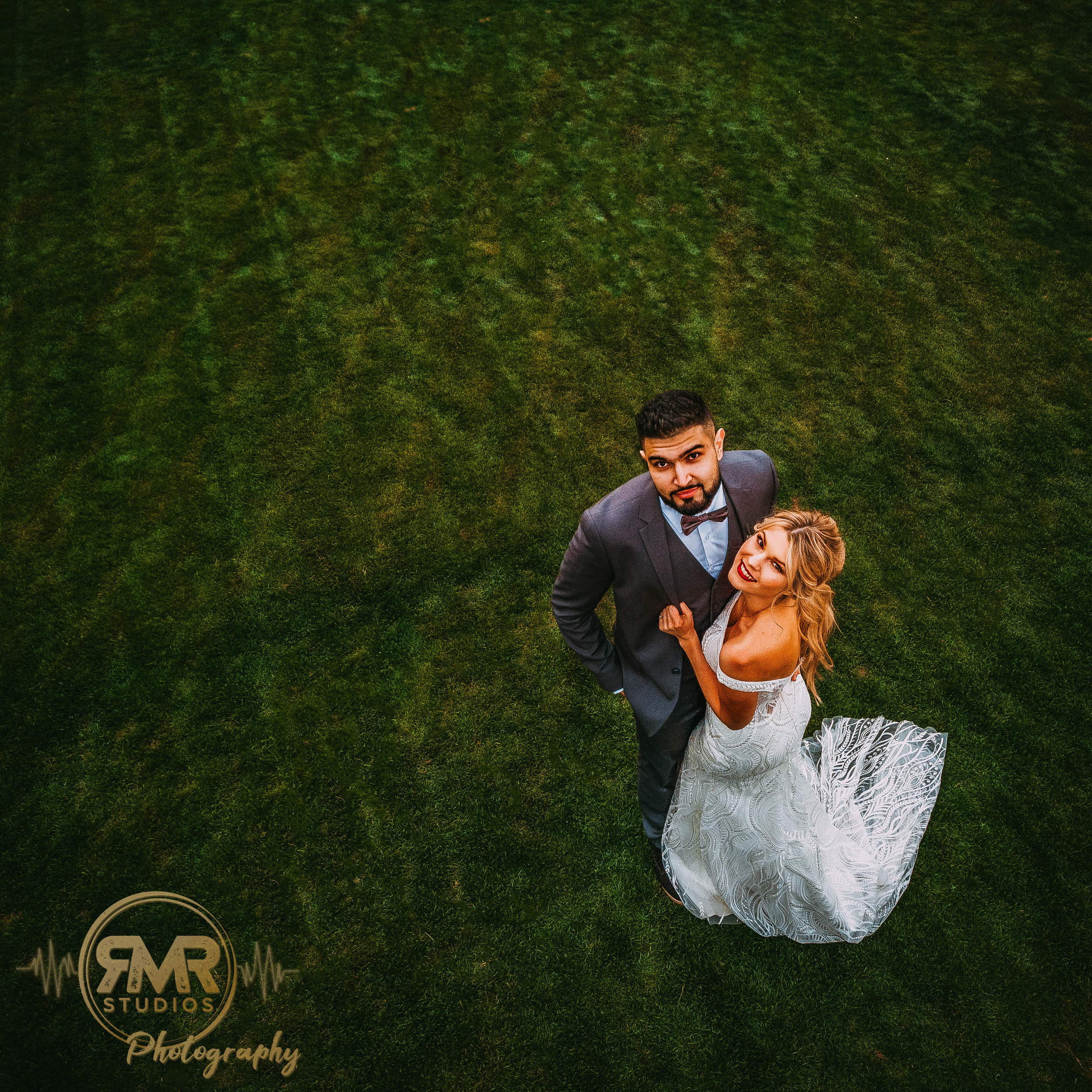 Bride and Groom looking at drone angled-1.jpg