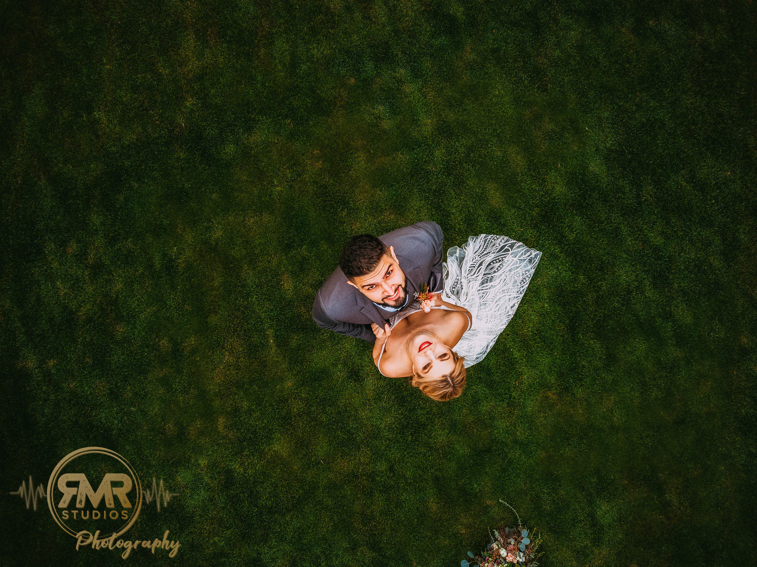 Bride and Groom looking up at drone-1.jpg