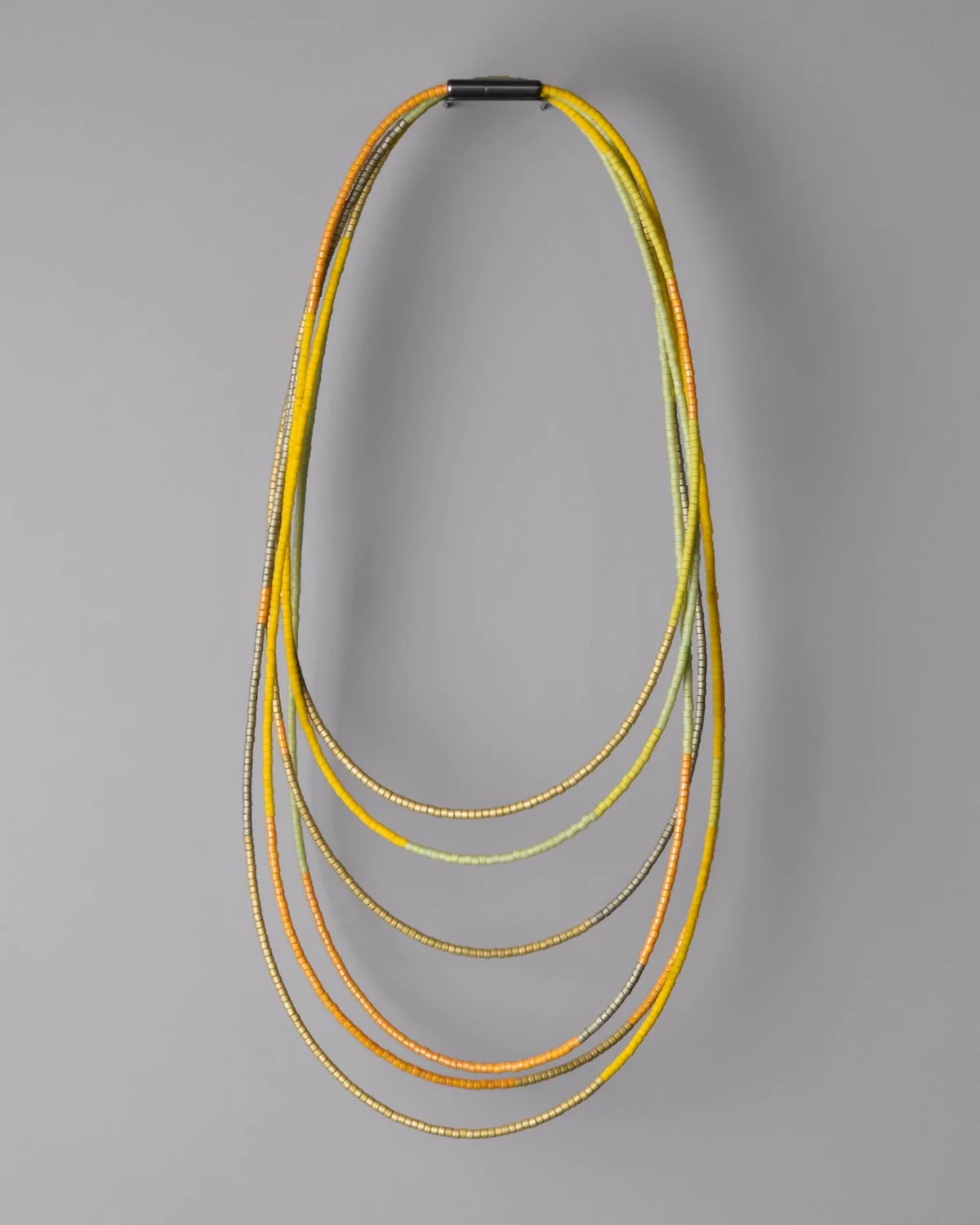 Citron Sweep Necklace — 8-foot beaded wrap necklace in bright citrus yellow-green Japanese glass Miyuki Delica beads, hanging vertically against a grey background