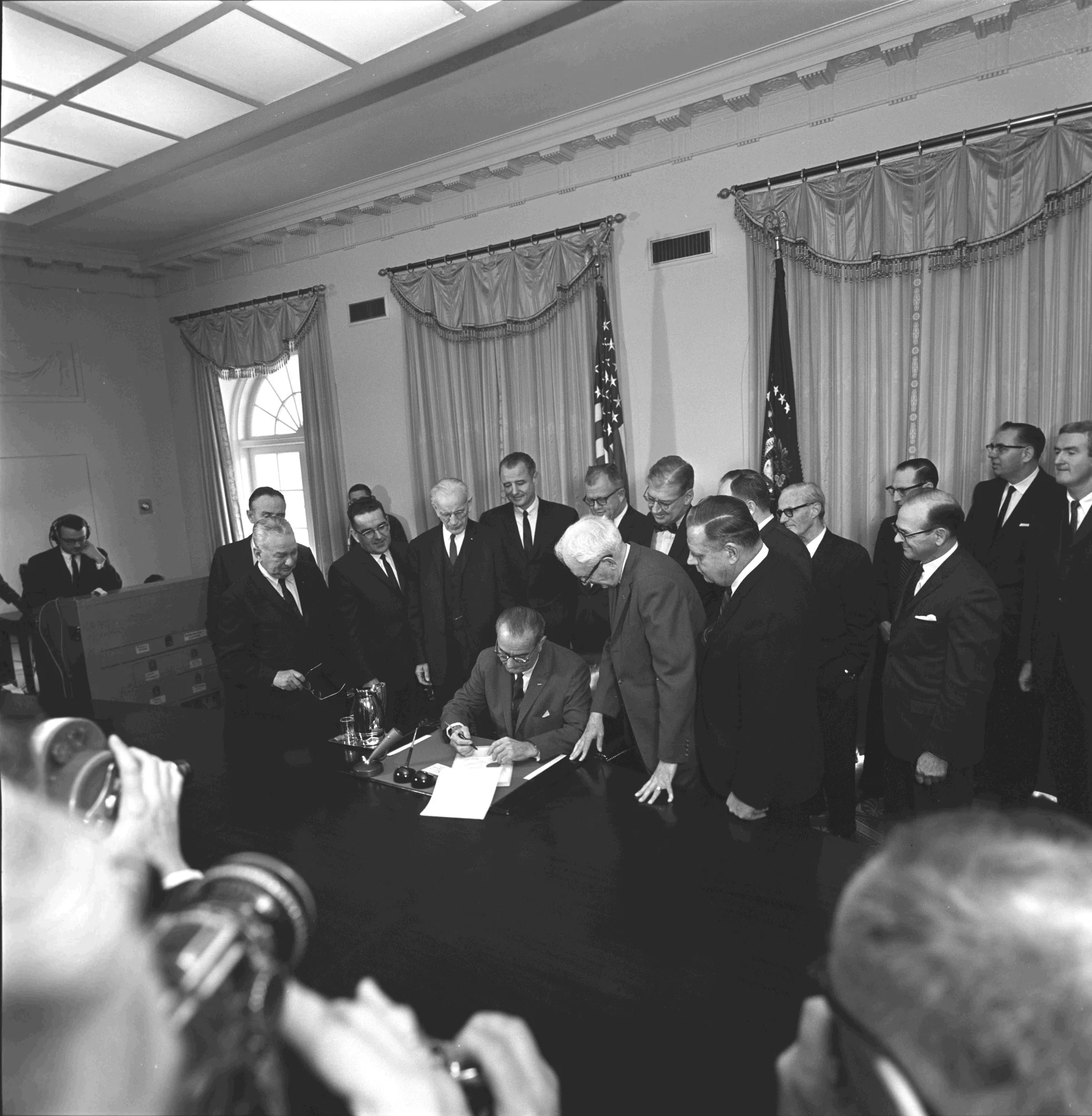 President Lyndon B. Johnson signing the Constitutional Amendment on the Poll Tax (Cecil W. Stoughton, Wikimedia Commons )