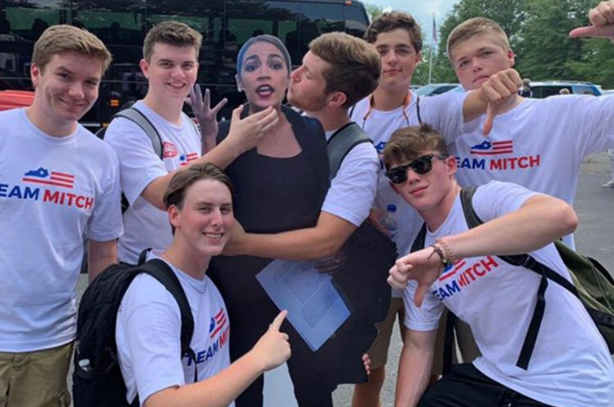 A group of young students showing their support for McConnell in the Republican way.