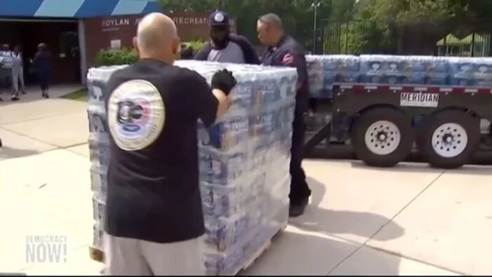 Water bottles being delivered in Newark, NJ ( Democracy Now! )