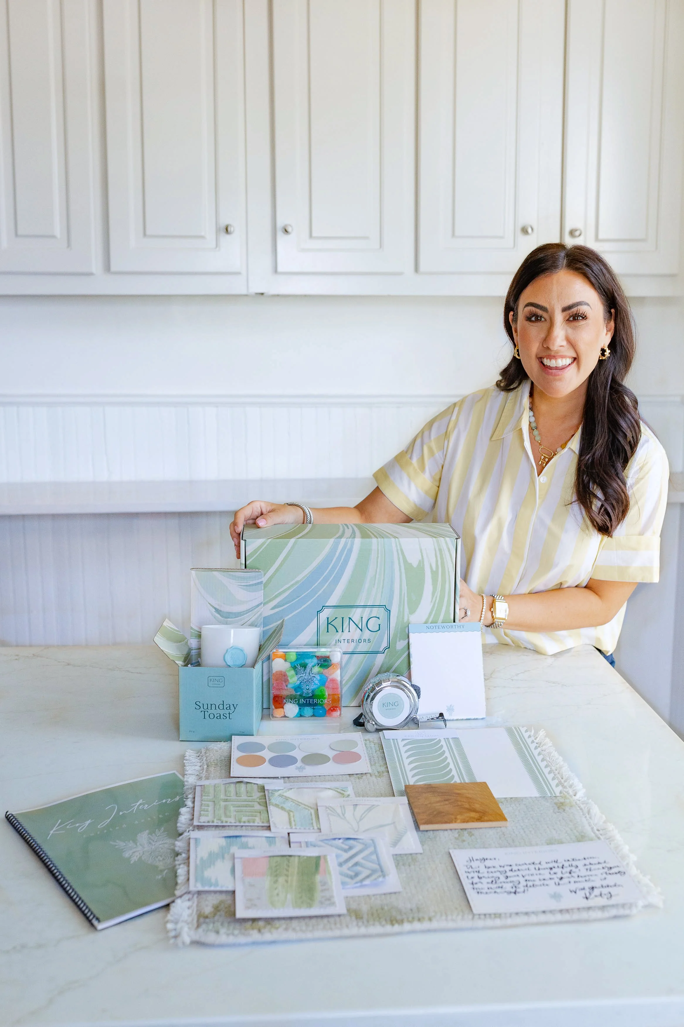 Katy King owner of King Interiors featured with her custom curated box for her Curated Virtual Design Experience service that is available nationwide
