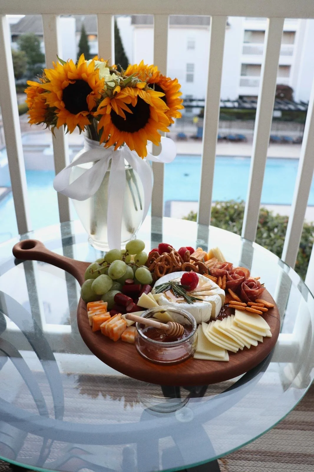 Charcuterie Board on porch next to flowers.JPG