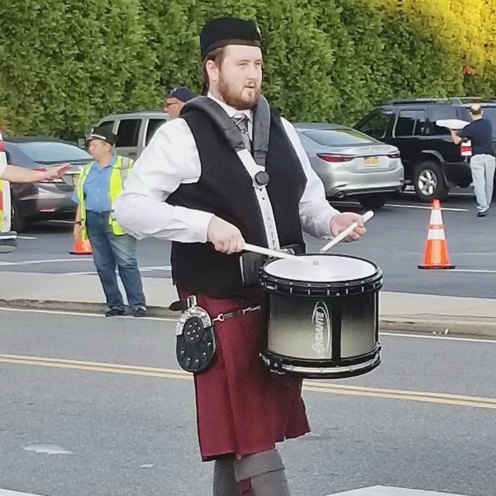 Our next member of the month is James Malone. James has been drumming since he was in the 4th grade, yet he took a break for about five years. He became interested in the band two years ago when his cousin Brendan, a current piper, convinced him to j