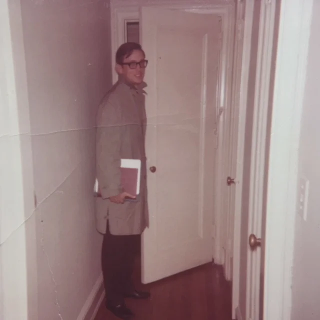 My dad in my parents’ first apartment. He doesn’t look like Charles, but I do think Charles probably had an overcoat just like that, and was always carrying books under his arm.