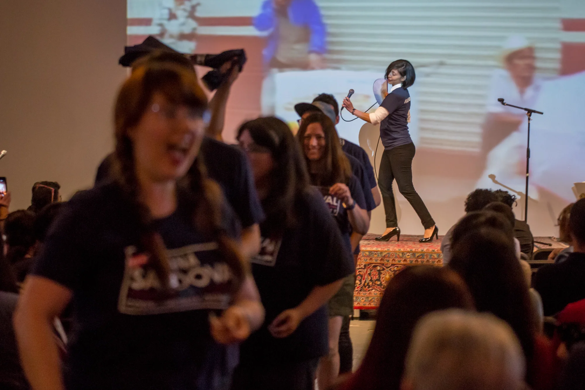 Ana Sandoval sings and struts while supporters dance down the aisle. (Photo Credit: Joel Pena, SA Sentinel Photographer )