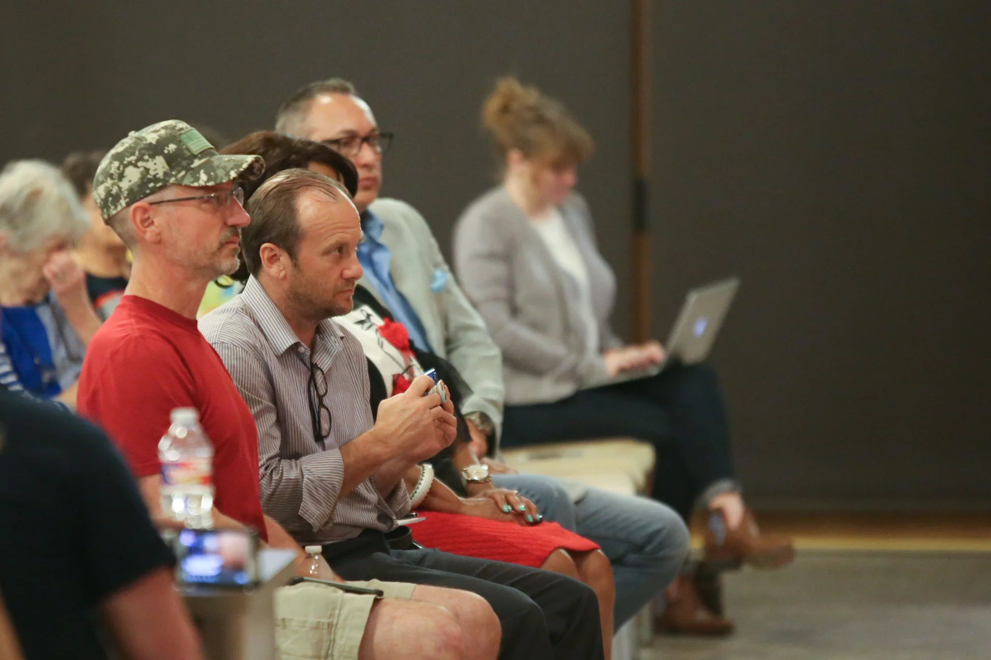 Audience members watch the debate unfold. (Photo Credit: GA Media Productions )