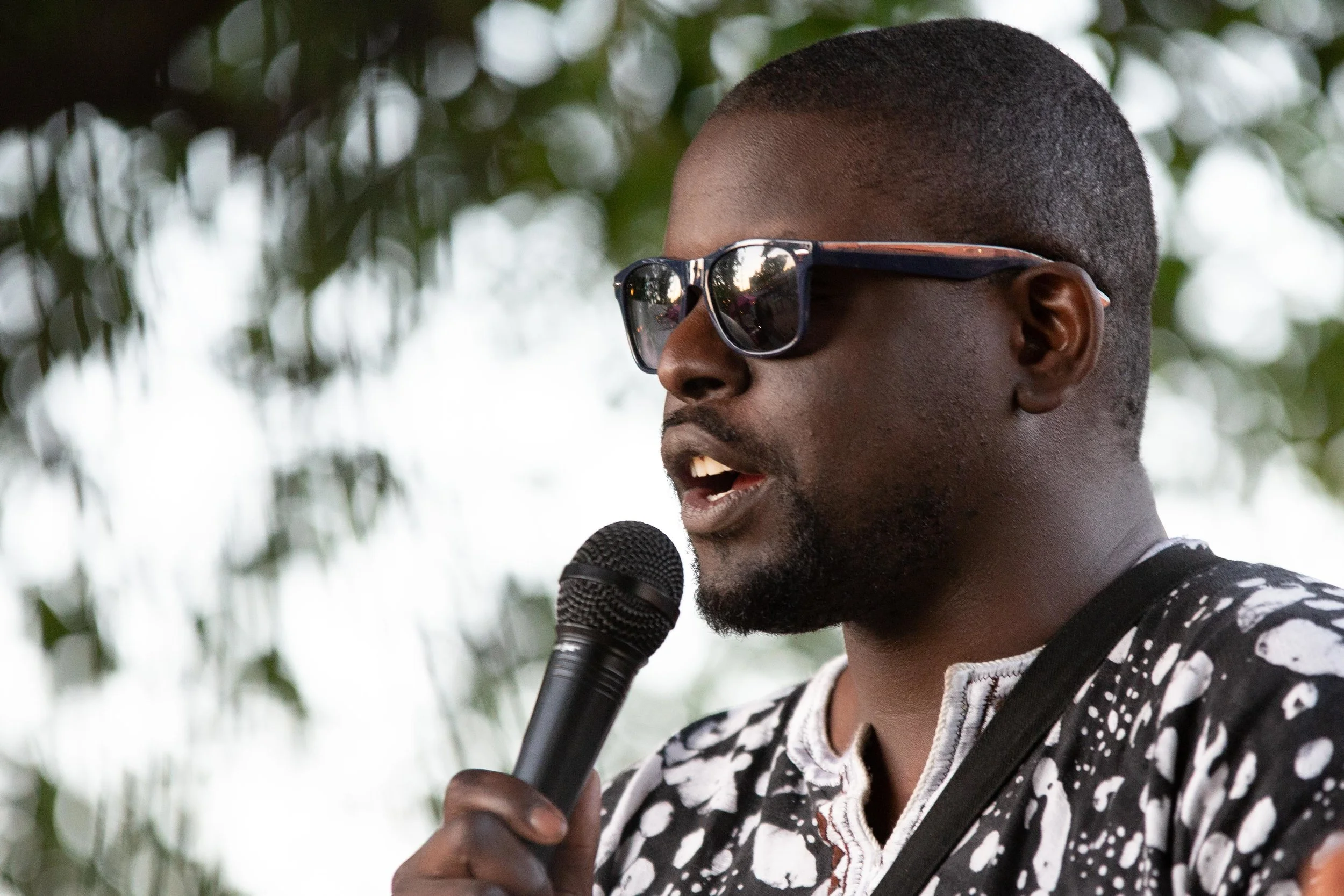 Kinyo speaks to the crowd at Burleson. (Photo by GA Media Productions .)