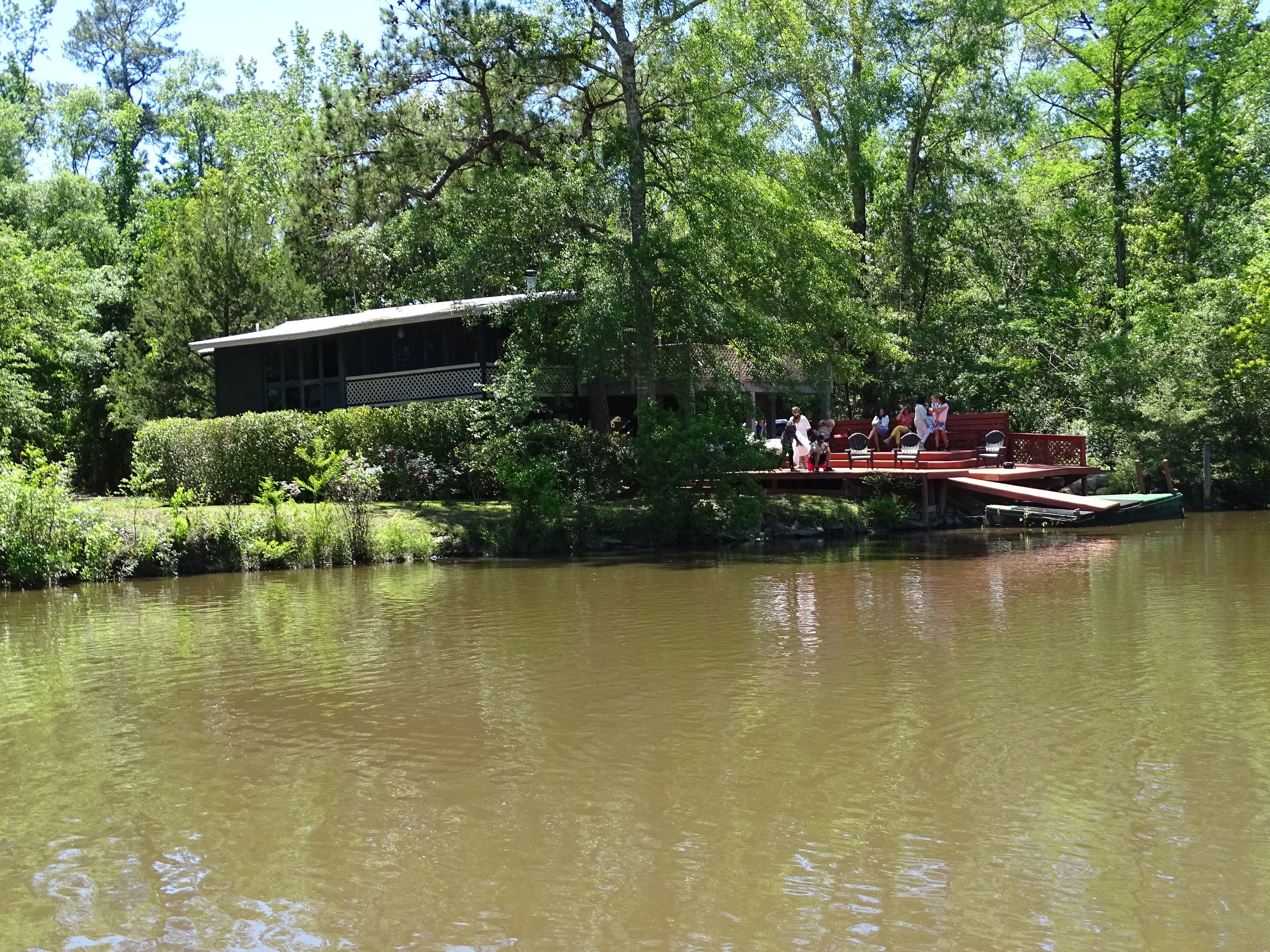  Houses on stilts appear along the Wolf River, but there are also many stretches of nothing but wild vegetation on the riverbanks.  
