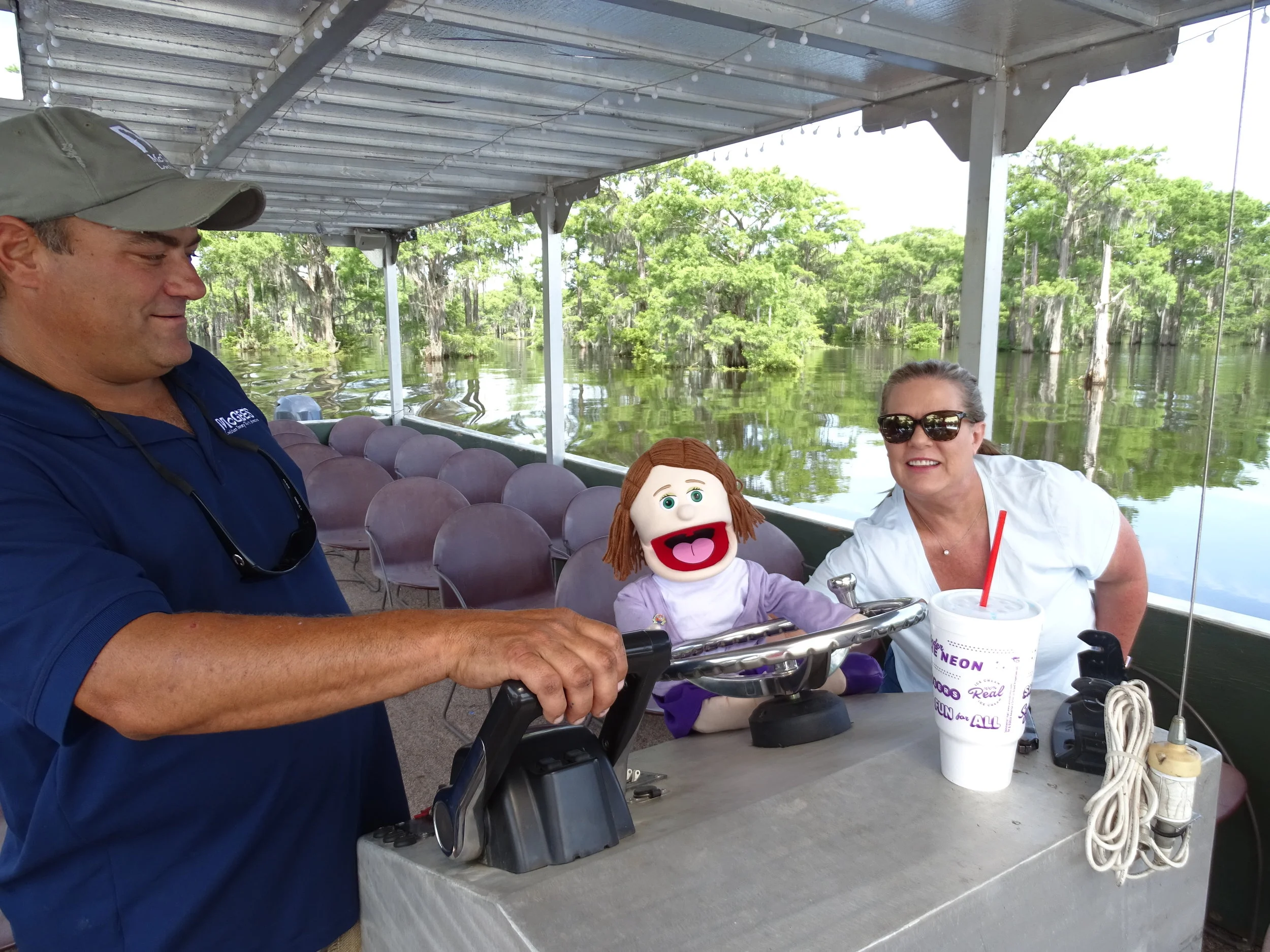  Captain Chris keeps a close watch on Arla while she takes a turn driving the boat. 
