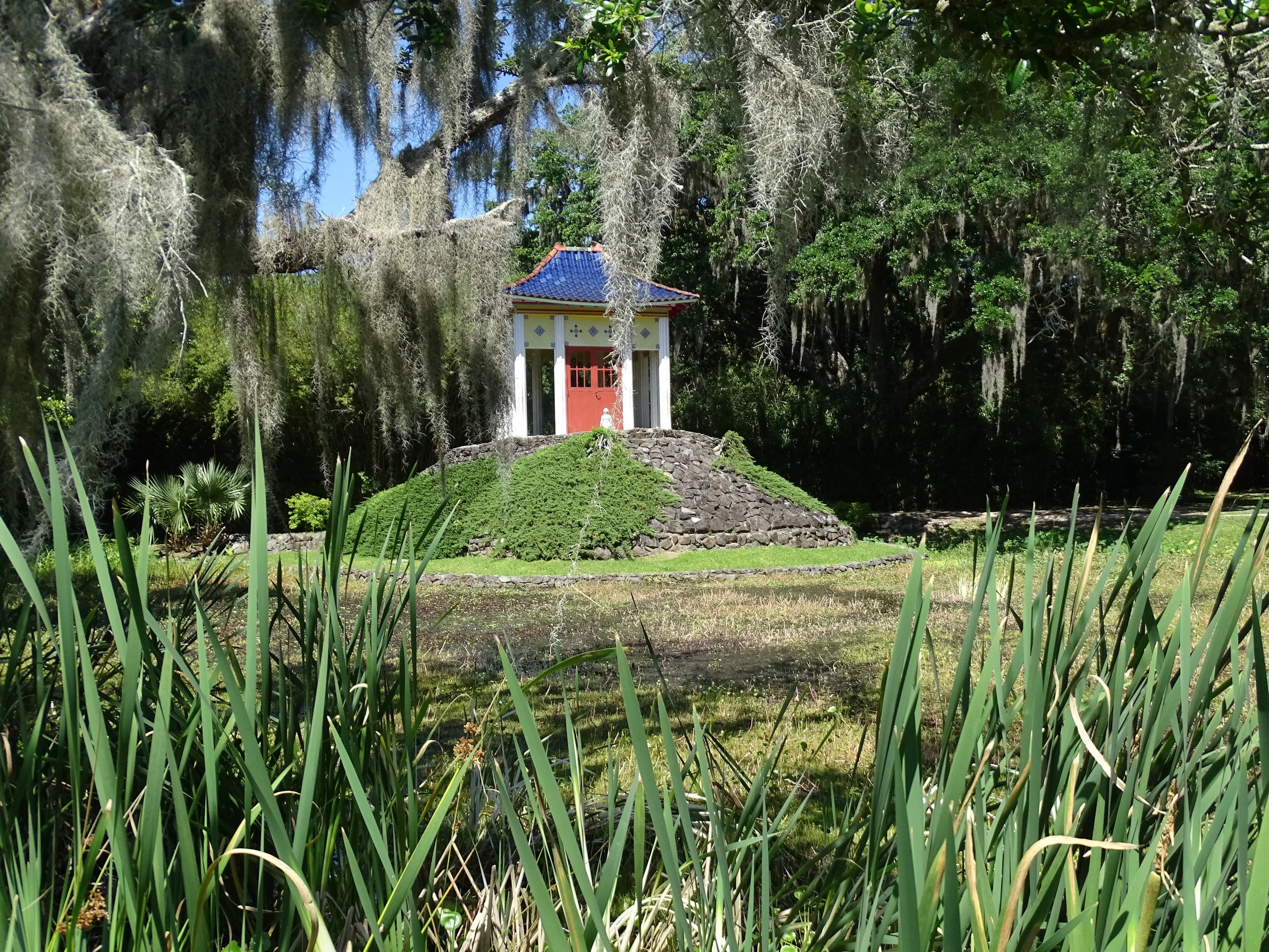  The Chinese Gardens section of Jungle Gardens includes a shrine with a Buddha statue dating back hundreds of years. 