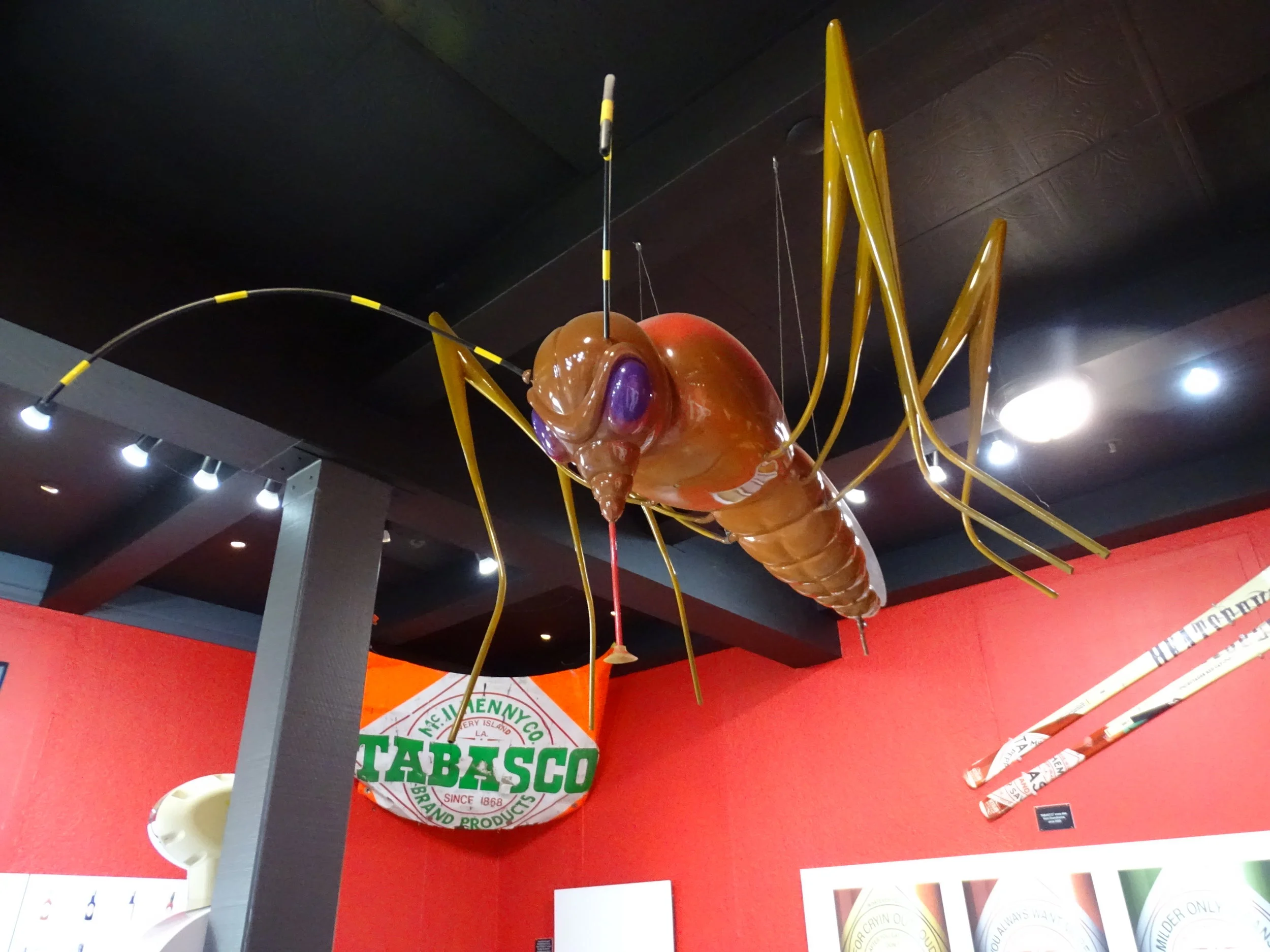  A giant mosquito hovers over factory tour participants when learning about Tabasco TV ads over the years, which have included mosquitoes being zapped when they bite people using Tabasco. 