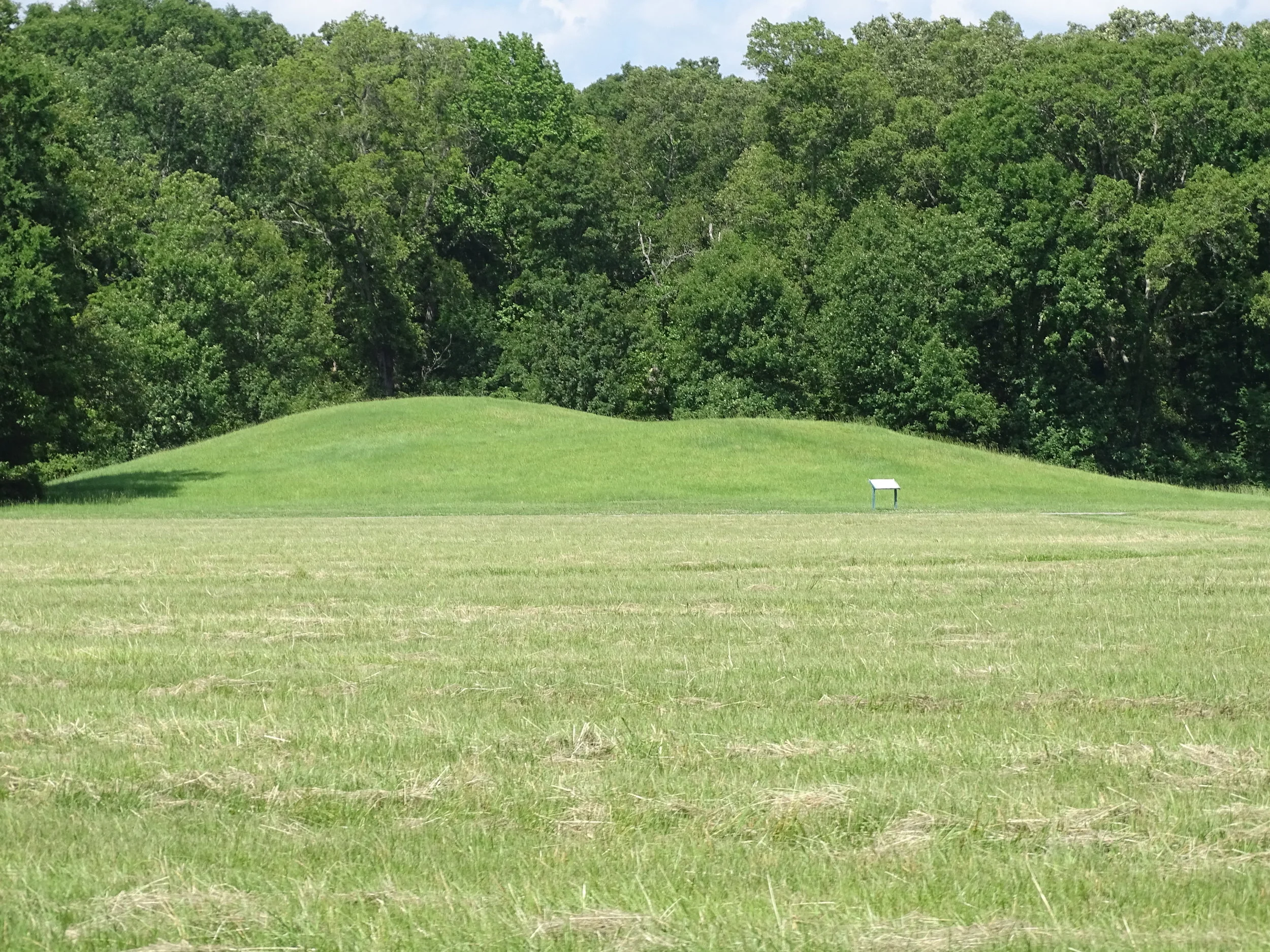 One of the smaller mounds at Poverty Point includes an indentation in the middle where archaeologists excavated it years ago.