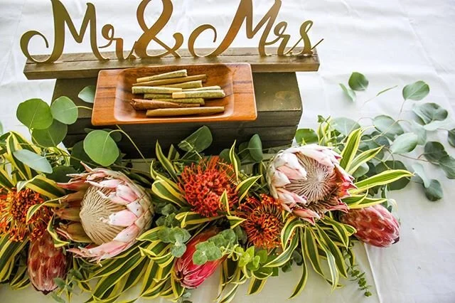 Incorporating cannabis into your wedding can be subtle and beautiful. This bride and groom added prerolled joints and blunts to their Sweetheart Table 💘
.
.
.
What kind of cannabis products would you like to see at your wedding?
.
.
Contact us today for a free consultation to see how you can integrate cannabis into your wedding or event ✨💍
.
.
.
#cannabiswedding #luxurywedding #cannabis #edibles #hawaii #budbar #personalroller #destinationwedding
#hawaiicannabis #elevated #getelevated #budtenders #cannabisisthenewchampagne