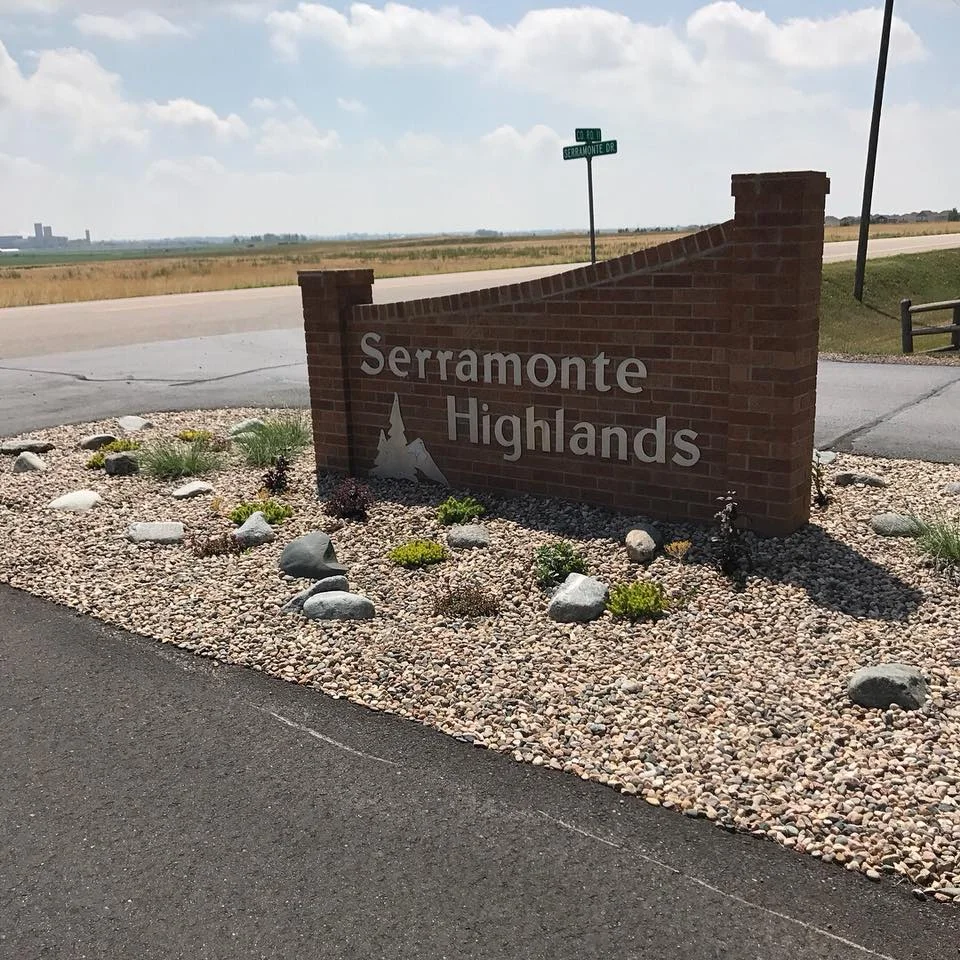 Landscape design around entry way sign for a local subdivision.